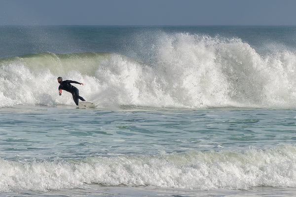 Lone Surfer vs. the Wave – Power and Motion