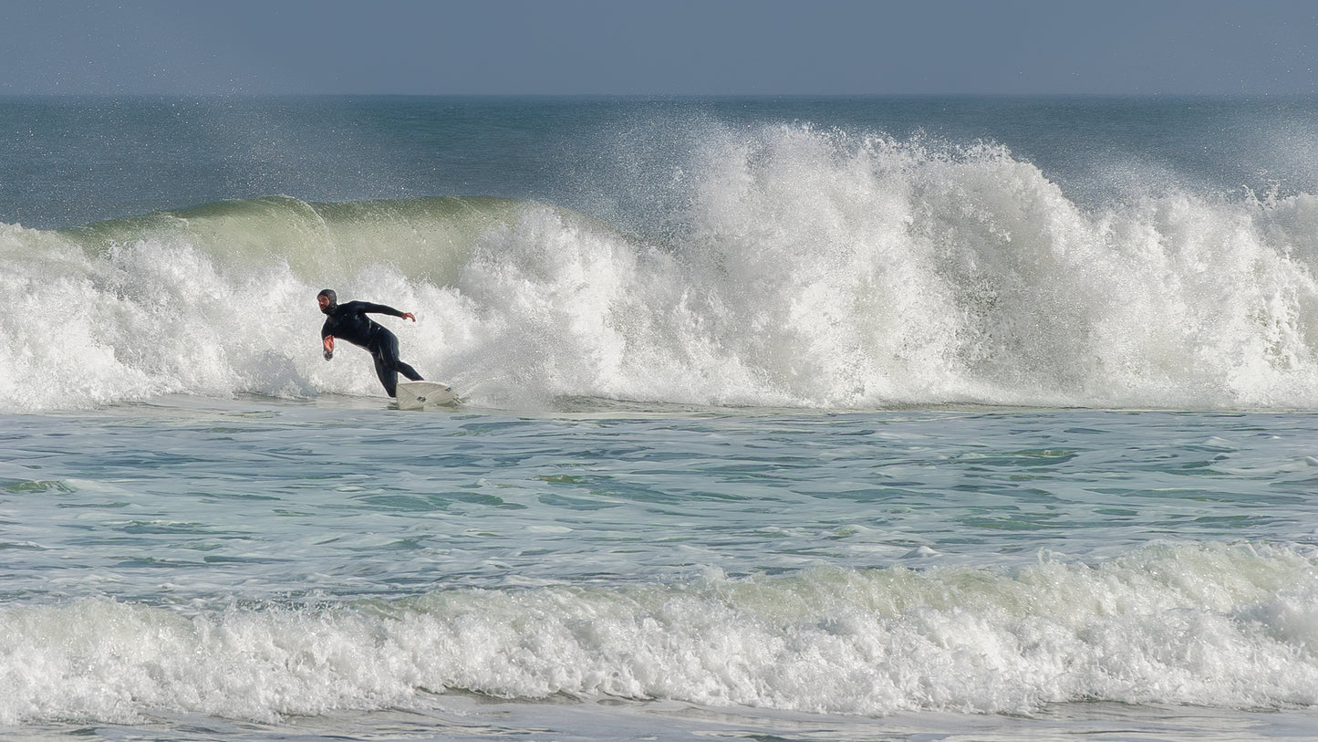 Lone Surfer vs. the Wave – Power and Motion