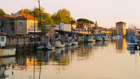 Golden Hour on Cervia Channel – Tower Reflections in Warm Light